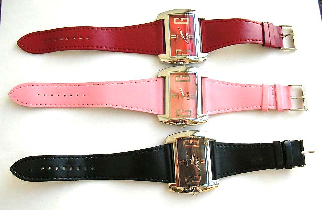 Fashion watch in fat rectangular or elliptical clock face design with or without button on imitation leather band decor