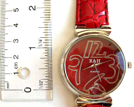 Fashion watch with rounded clock face and imitation leather band design