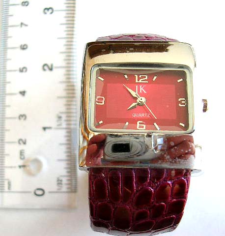 Wide band fashion bangle watch with rectangular clock face design and crack decor on band