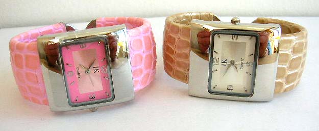 Wide band fashion bangle watch with rectangular clock face design and crack decor on band