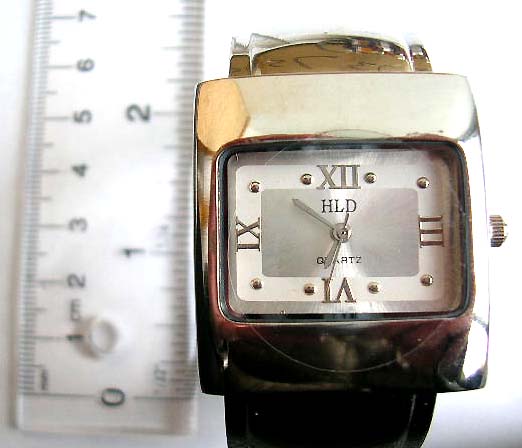 Fashion wide band bangle watch with wide rectangular clock face design