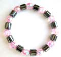 Hematite stretchy bracelet with multi short cylinder shape hematite beads and pinkish multi facet beads inlaid