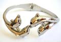 Fashion bangle bracelet with 4 kiss dolphin family pattern design at center