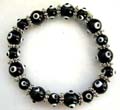 Multi black hand-painted Chinese lampwork glass bead and flat silver beads forming fashion stretchy bracelet 