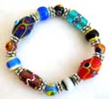 Fashion stretchy bracelet with multi long and rounded hand-painted Chinese lampwork glass bead and flat silver beads inlaid 