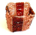 Fashion stretchy bracelet in multi connected dark and light brown beaded string design 