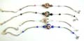 Fashion bracelet in curve strip design with diamond shape arylic beads holding a flat rounded tibetan flower bead at center, assorted color randomly pick 