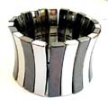 Fashion stretchy bracelet in multi black and silvery flat curved strip design 