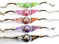 Fashion bracelet with 2 curve strips holding an gloden sun face decor, enamel color circle pattern at center, assorted color randomly pick