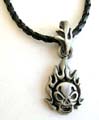 Fashion necklace with black twisted imitation leather string holding a flaming skull metal pendant at center
