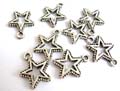 Silver plated charm pendant in dotted around central carved-out star pattern design