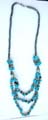 Fashion hematite necklace with multi short cylinder shape hematite beads inlaid and multi blue turquoise stone chips inlaid triple string pendant at center 