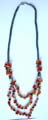 Fashion hematite necklace with multi short cylinder shape hematite beads inlaid and multi agate stone chips inlaid triple string pendant at center 