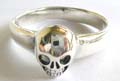 Stamped 925. sterling silver ring with tskull pattern central decor