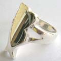 925. sterling silver ring with open-moth band holding a fish pattern central design