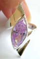 925. sterling silver ring with with curve pattern holding a large light purple color olive shape cz stone at cneter