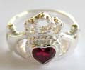 Claddagh ring made of 925. sterling silver ring with a heart love red garnet stone at center