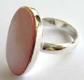 Stamped 925. sterling silver ring with large elliptical shape pinkish mother of pearl seashell stone inlaid at center