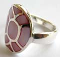 Stamped 925. sterling silver ring with multi line sectioned, pinkish mother of pearl seashell inlaid oval shape pattern central design