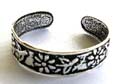 Sterling silver toering with multi carved-out sun flower pattern design