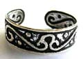 Black sterling silver toe ring with carved-out floral pattern design