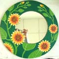 Green rounded wooden mirror with yellow sun flower decor