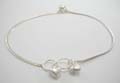 Sterling silver anklet with double solid hearts.