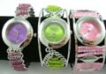 Beaded bangle watch with assorted twist wire pattern and circle clock face design