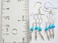 Solid 925. sterling silver fish hook earring with triple S shape holding a turquoise beads and dangle