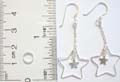 Enamel sterling silver fish hook earring with cut-out star holding a mini star pattern