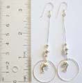 Enamel 925. sterling silver beaded fish hook earring with circle holding a dolphin