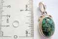925. sterling silver pendant with turquoise stone embedded olive shape