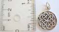 Sterling silver celtic pendant with heart shape forming in flower pattern 