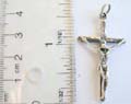 Plain cross design sterling silver pendant with a skull pattern in middle 