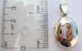 Plain oval shape sterling silver locket pendant.
