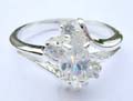 4 mini cz holding a oval shape cz with wavy line design made of 925. sterling silver ring 