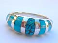 Sterling silver ring with 7 irregular shape turquoise stone embedded in middle