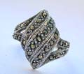 925. Sterling silver ring with 3 multi marcasites bands central design