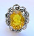 Multi marcasites beaded in cut-out flower shape design sterling silver ring with a oval yellow cz stone in middle
