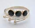 925. sterling silver toe ring with 3 rounded black cz stone embedded swirl loop pattern central design.