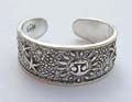 Black sterling silver toering with carved-out dot and sun pattern decor 