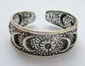 Black sterling silver toering with carved-out dot, sun, moon and star pattern decor 