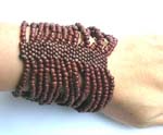 Brown seed beaded bracelet forming in wide band design