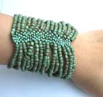 Mavelle seed beaded bracelet forming in wide band design 
