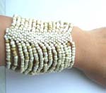 Seashell white seed beaded bracelet forming in wide band design 