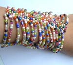 Assorted rainbow seed beaded bracelet forming in wide band design