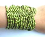 Green rainbow seed beaded bracelet forming in wide band design 