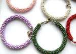 Assorted multi color seed bead forming in bangle