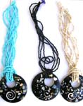 Multi seed bead necklace with O shape black pendant holding mini shell chips and spiral pattern design