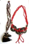 Assorted multi seed beaded strings necklace with horse and triple coconut wooden pendant design